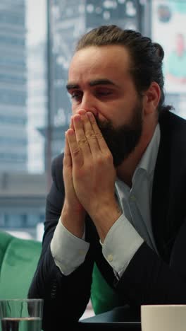 Vertical Video Worried hopeless businessman working under pressure in despair