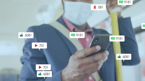 animation of media notifications and african american man in face mask using smartphone on bus