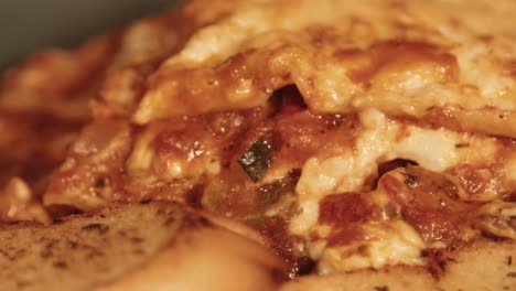 Close-Up-Pan-of-Rustic-Freshly-Cooked-Lasagna-and-Garlic-Bread-Slices