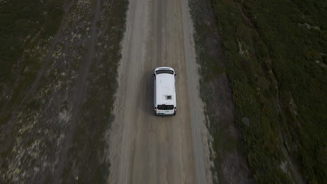 top aerial shot of van moving in the street of norway