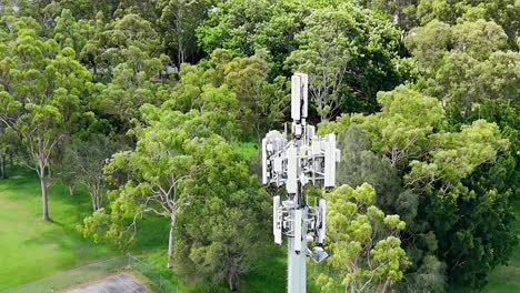 aerial view of cell tower amidst greenery