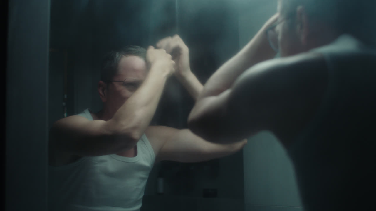 A sad man in the bathroom during his morning routine