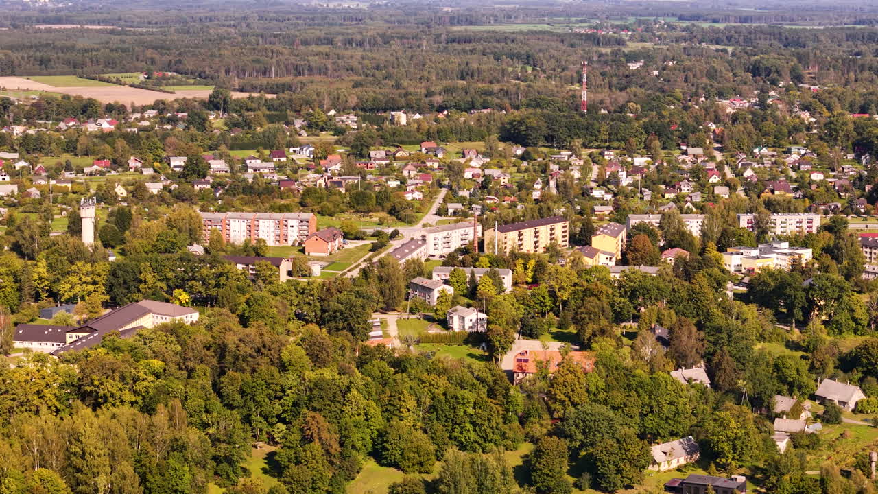 Beautiful small trown of Koknese with green woodlands around, aerial view