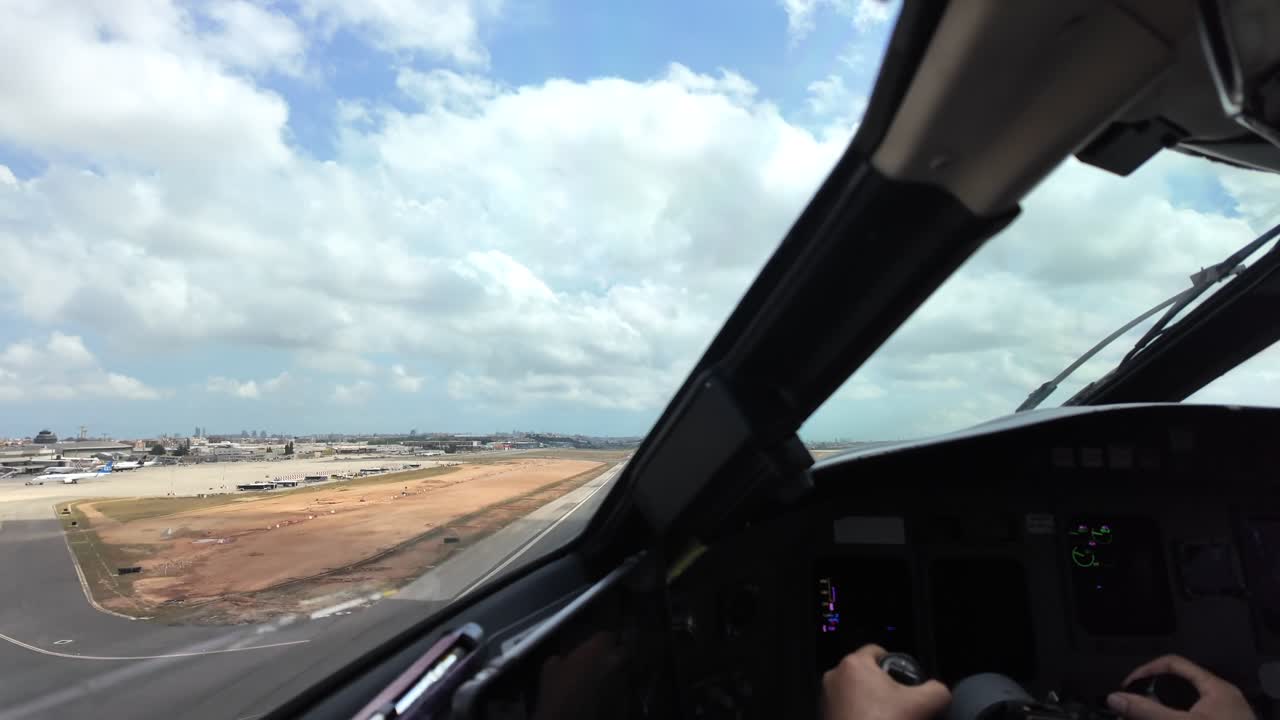 Hands of a caucasian pilot grasping the flight controls in a real time takeoff, Captain FPV, during the roation and initial climb.