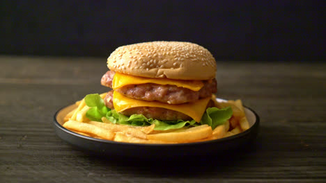 pork hamburger or pork burger with cheese and french fries