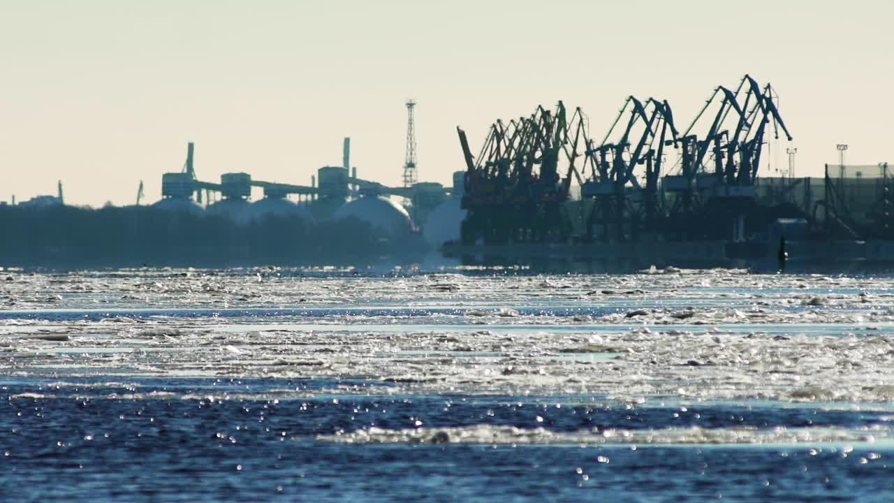 Shipping port on Gulf of Riga coast, winter sea ice at Daugava River mouth
