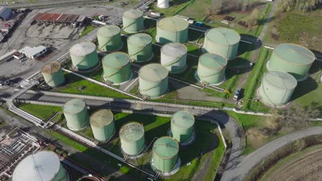 aerial view of steel round oil storage tanks, storage and handling services for petroleum products