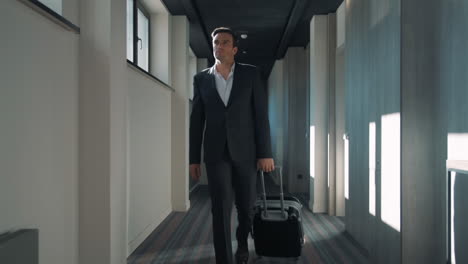 business man walking at hotel corridor. businessman arriving at business hotel