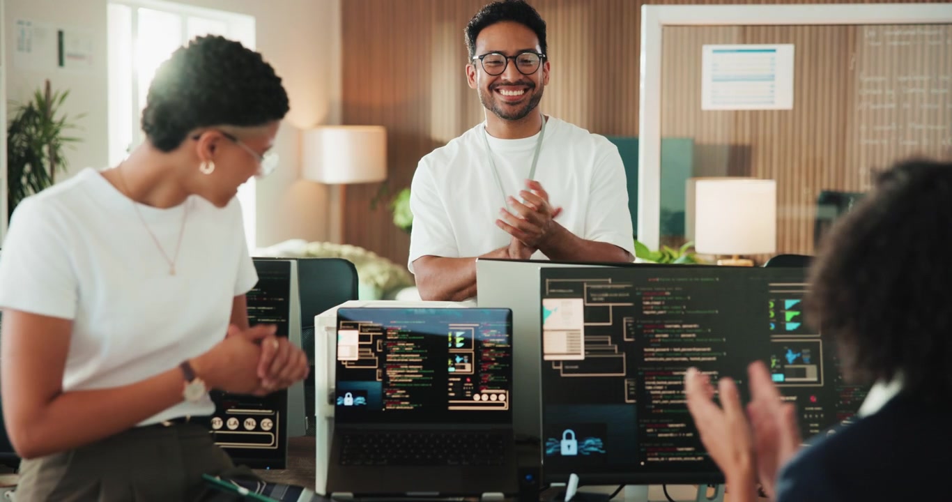 Diverse Team of Software Developers Celebrating Success in Modern Office