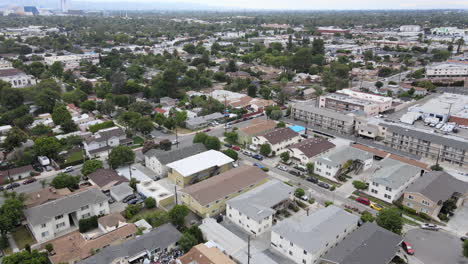 aerial tilt up shot descending over glendale district on cloudy day