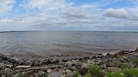 view of raritan bay from a rock shoreline