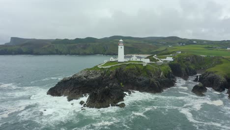 Aerial-view,-pan-left,-4K,-Fanad-Head-Lighthouse,-located-in-the-north-coast-of-Ireland