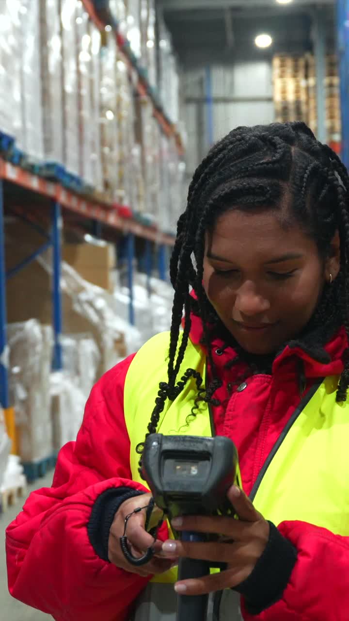 Woman scanning in a warehouse