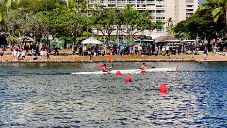 kayakers finishing a race in hawaii