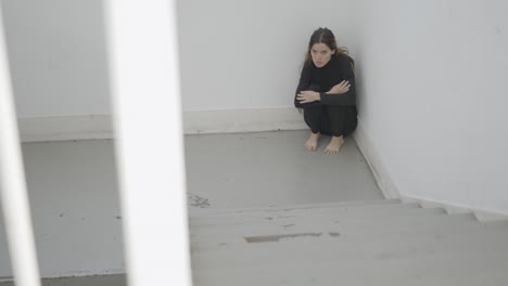 woman in a corner