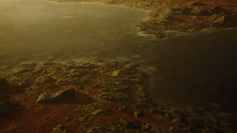 beautiful view of foggy mountains with a reflection in a lake