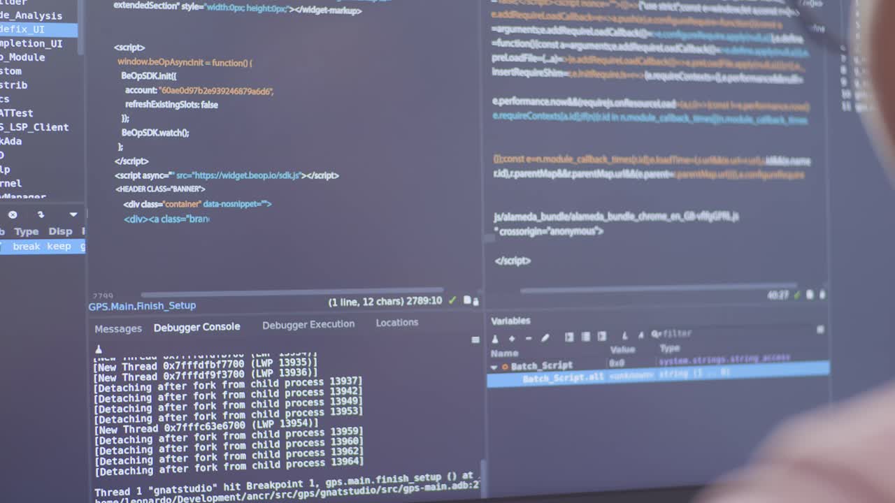 Close-up view of a programmer working on code in a code editor.