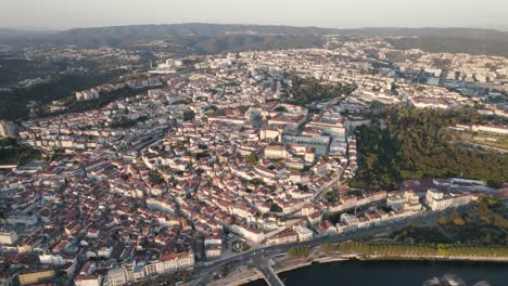 panoramic view of coimbra sprawling cityscape with university on top of the hill