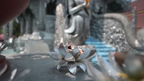 a burning candle at the silver temple in chiang mai