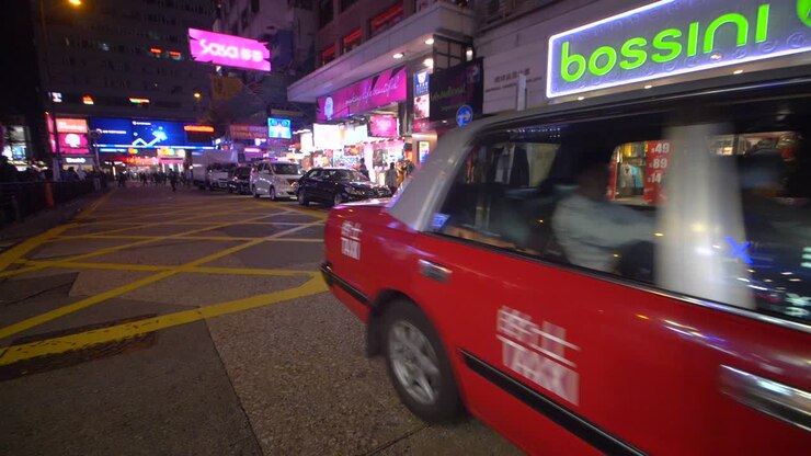 Taxi Passing Through Downtown Hong Kong