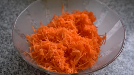 bowl of grated carrots, ingredient for carrot cake