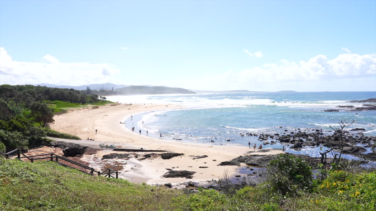 High angle wide shot of Sawtell beach on a sunny day, New South Wales, Australia