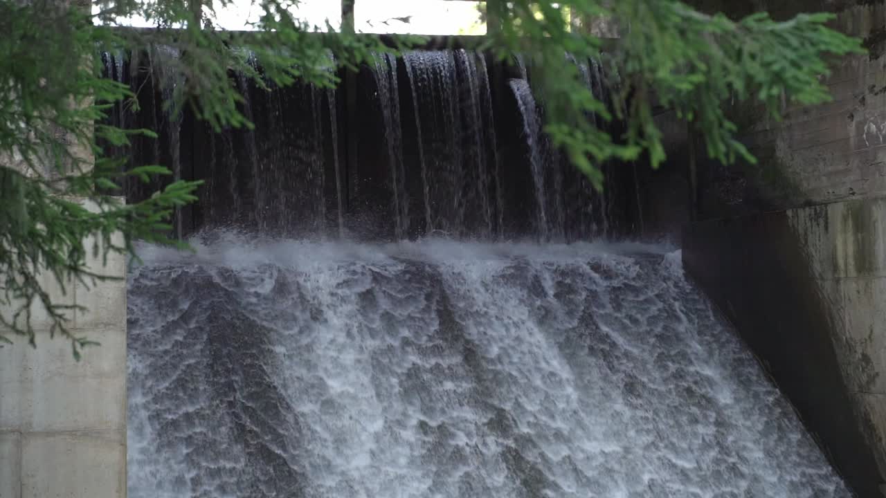 Water flow at Saesaare hydroelectric dam in slow motion, closer view