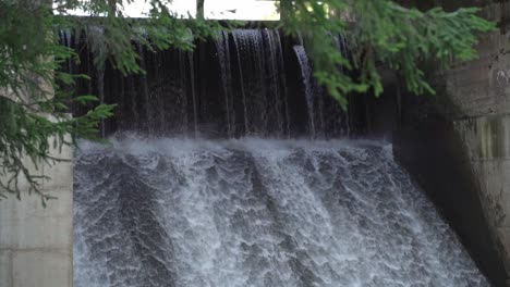 Water-flow-at-Saesaare-hydroelectric-dam-in-slow-motion,-closer-view