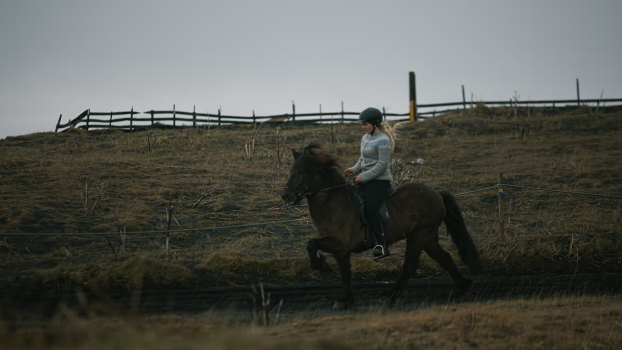 Woman horseback riding in Iceland