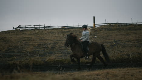 woman horseback riding in iceland