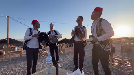 traditional drumming performance at a desert camp