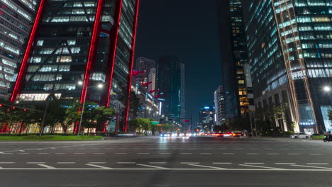 Vehicle-Light-Trails-at-Busy-Crossroads-Near-Yeouido-Skyscraper,-Seoul,-Korea---Panning-Hyperlapse