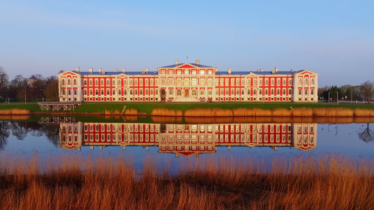 Early morning drone shot captures golden hour light on Jelgava Palace facade