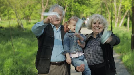 family of grandparents takes off medical masks after coronavirus quarantine end