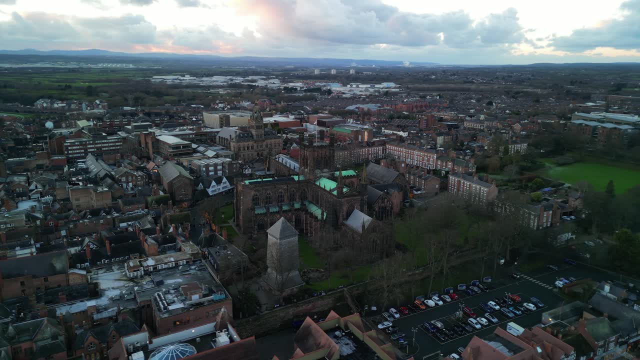 Historic Chester Cathedral anti-clockwise pan by drone in winter golden hour, UK