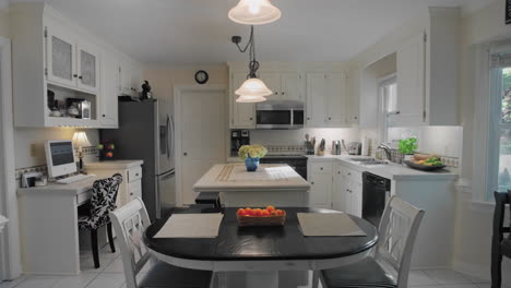 gimbal shot of and empty white kitchen in the suburbs