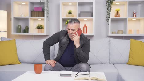 old man arguing with his wife on the phone.