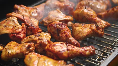 Delicious-chicken-pieces-frying-on-barbecue-grill