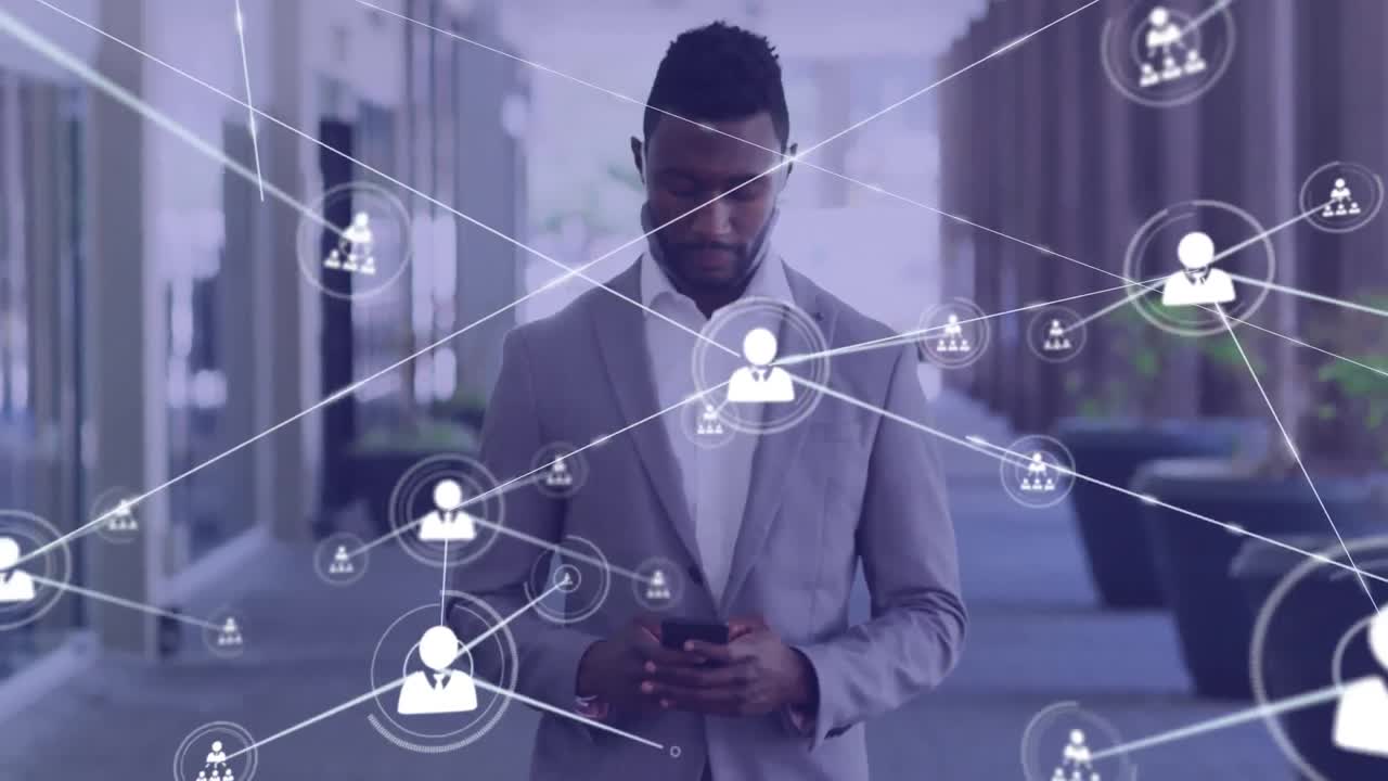 Animation of network of connected icons with businessman using smartphone walking in street