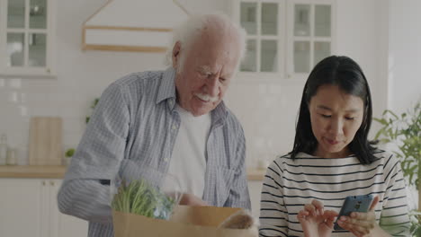 elderly couple grocery shopping
