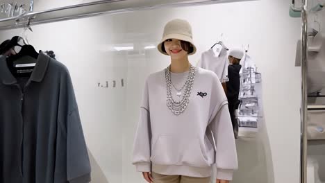 fashion model showcasing a trendy streetwear outfit featuring a bucket hat and layered chain necklaces