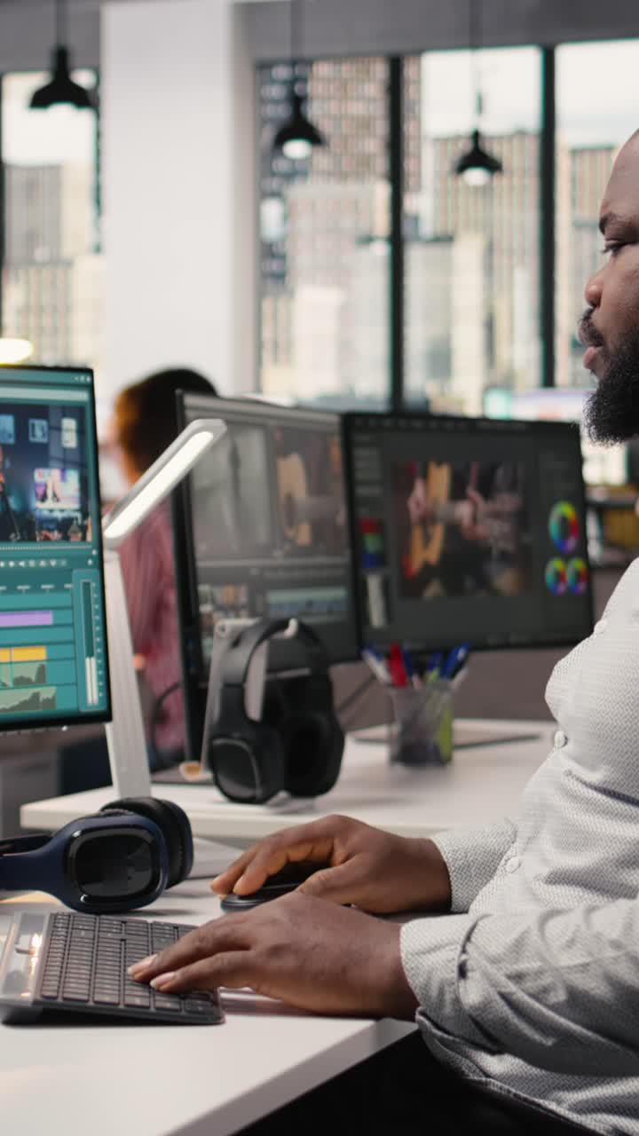 Vertical Video Black Man Working On Film Footage Editing And Cutting Clips For Motion Graphics