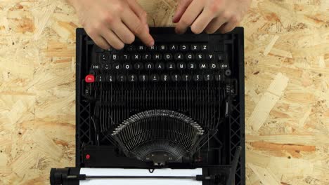 hands repairing an old typewriter