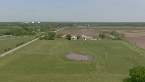 aerial view of atv at the pond at a farm house in kansas