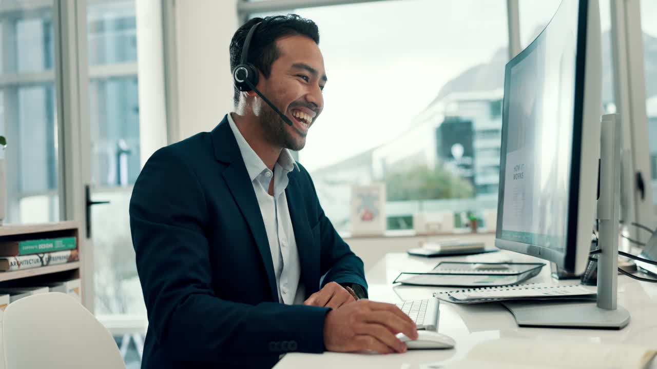 Happy Man in Headset Working on Computer in Modern Office