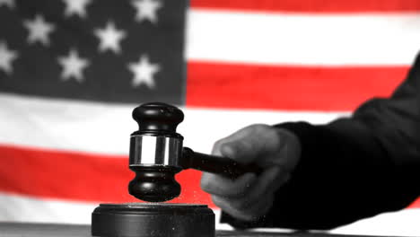 Judge-calling-order-with-gavel-in-american-court-in-selective-black-and-white