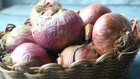 close-up of red onions in a basket