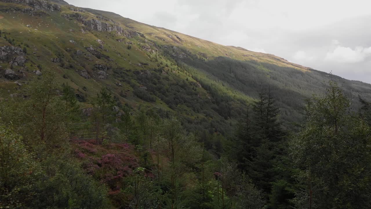 Aerial footage over the Rest and Be Thankful pass in the Arrochar Alps. The Arrochar Alps are a group of mountains located around the head of Loch Long, Loch Fyne, and Loch Goil, Scotland, UK