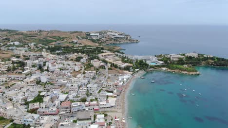 aerial over coastal town and beach in crete