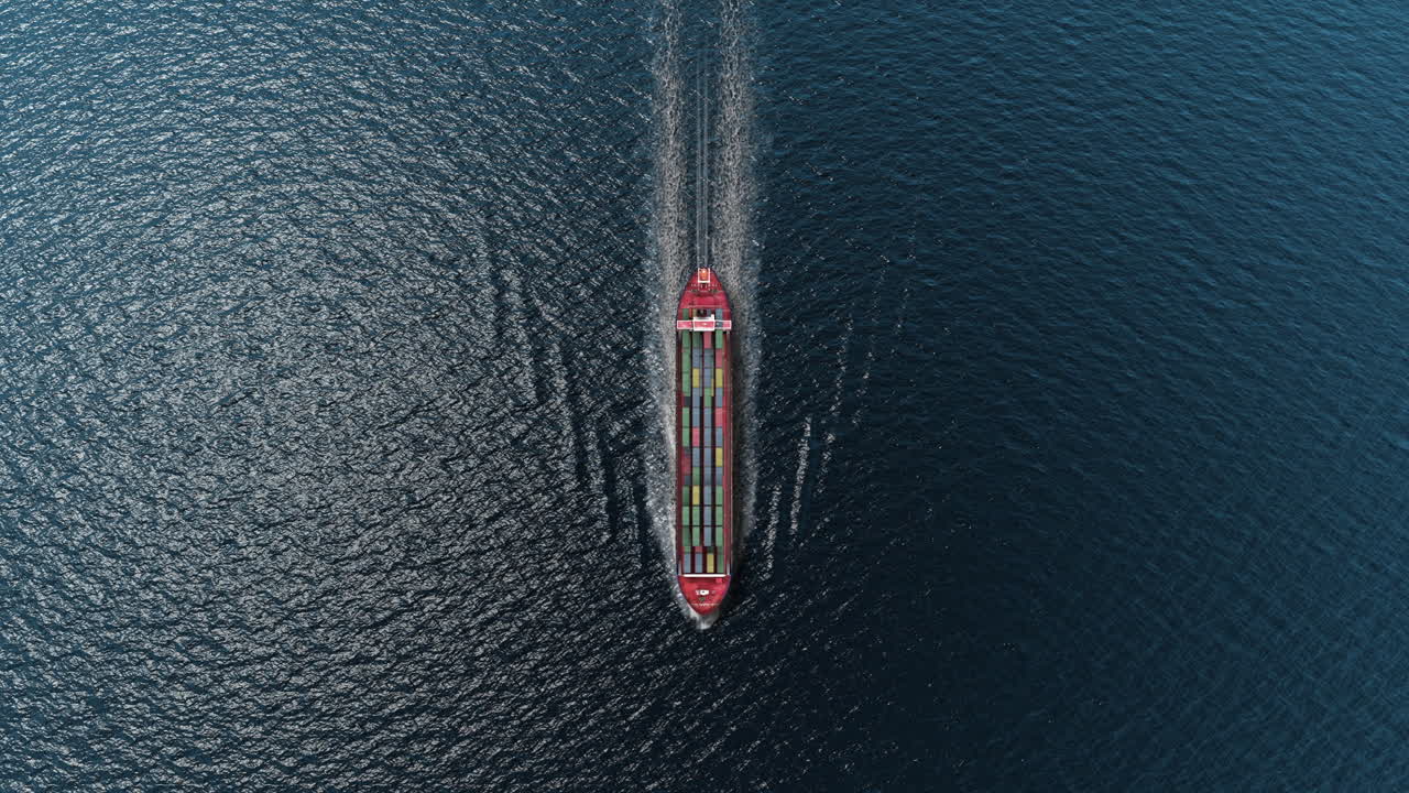 Aerial View of a Cargo Ship Navigating the Open Ocean